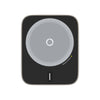 Black electronic device with circular gray center on a white background